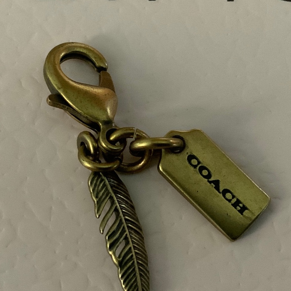 COACH BAG CHARM TAG feather brass